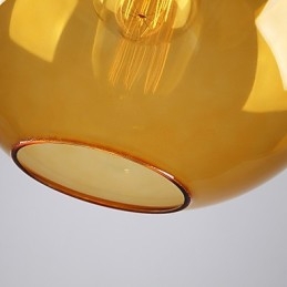 Lampada a sospensione moderna in vetro color ambra con paralume rotondo a bolle