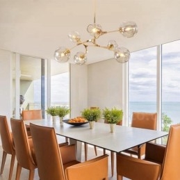 Lampadario contemporaneo a 7 luci con paralumi in vetro trasparente 120 x 42 cm
