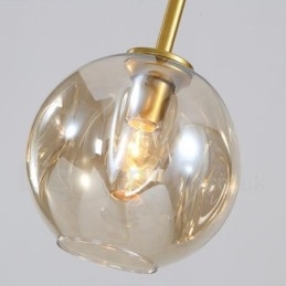 Lampadario contemporaneo a 7 luci con paralumi in vetro trasparente 120 x 42 cm