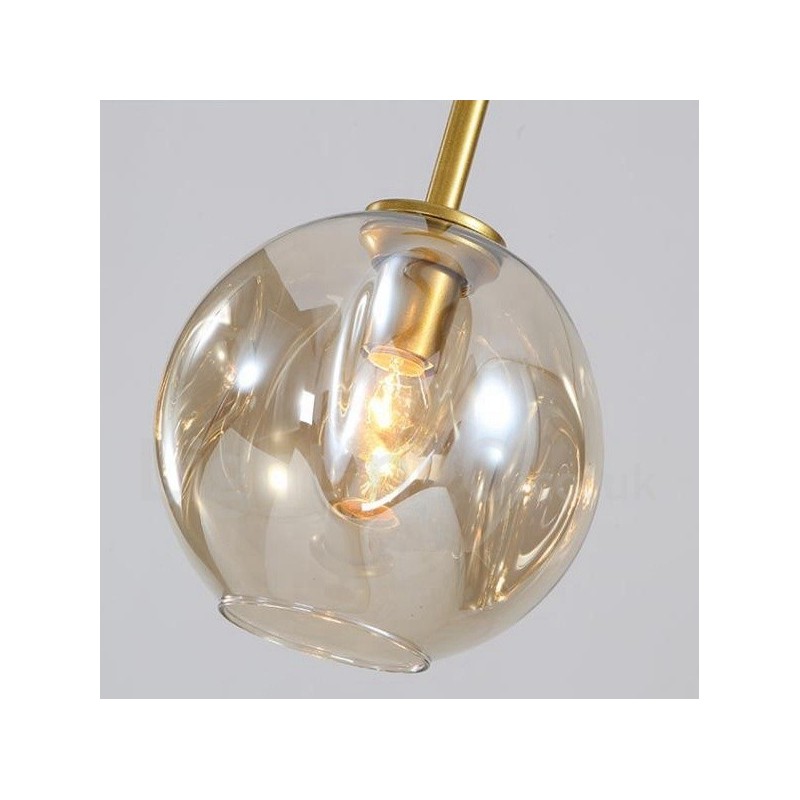 Lampadario contemporaneo a 7 luci con paralumi in vetro trasparente 120 x 42 cm