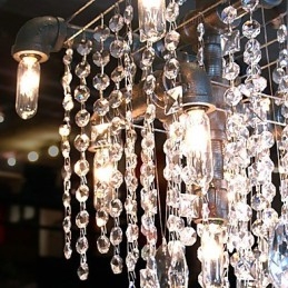Lampadario in cristallo nero a 9 luci con design a tubi