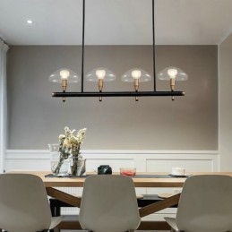 Lampadario lineare a 4 luci oro e nero con paralumi in vetro trasparente