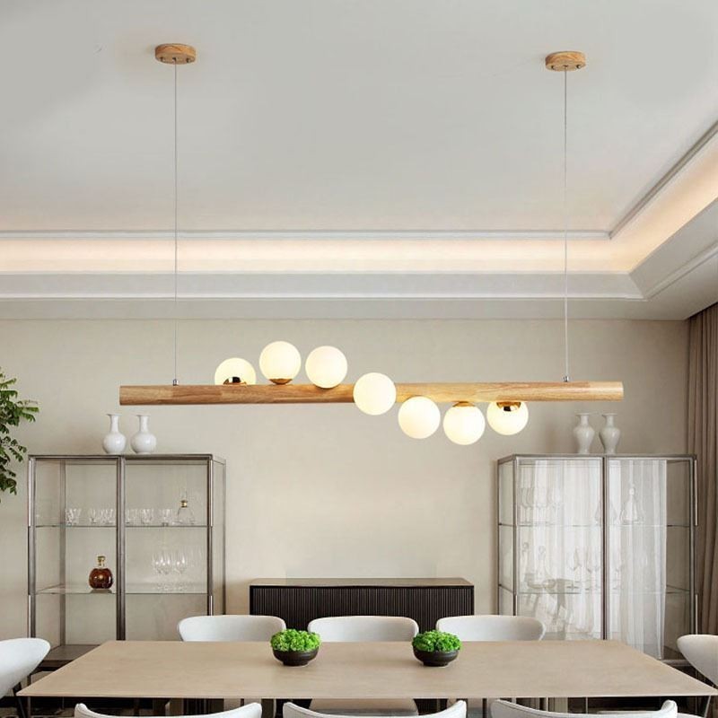 Lampada a sospensione Magic Bean in legno e vetro con strisce di legno