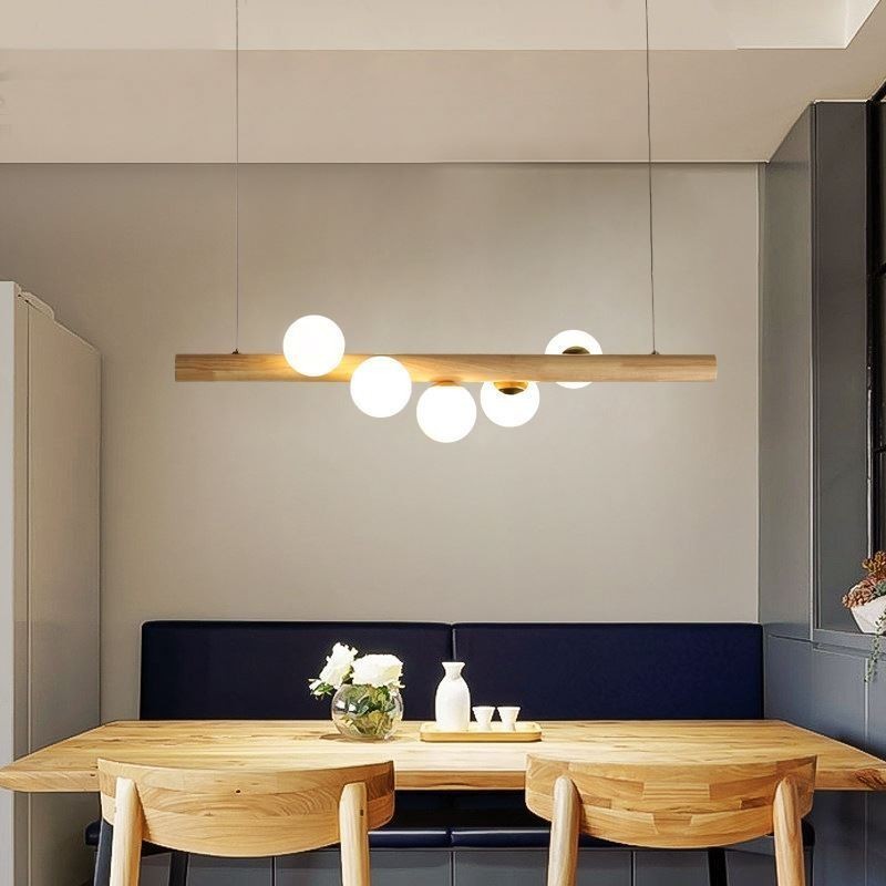 Lampada a sospensione Magic Bean in legno e vetro con strisce di legno