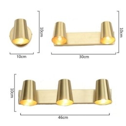 Applique da parete nordica in ottone con faretto frontale a specchio